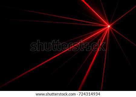 Red laser beams light effect on black background photo. Royalty-Free Stock Photo #724314934