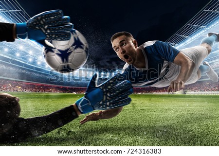 Goalkeeper catches the ball in the stadium