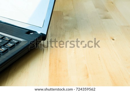 Wooden table with laptop