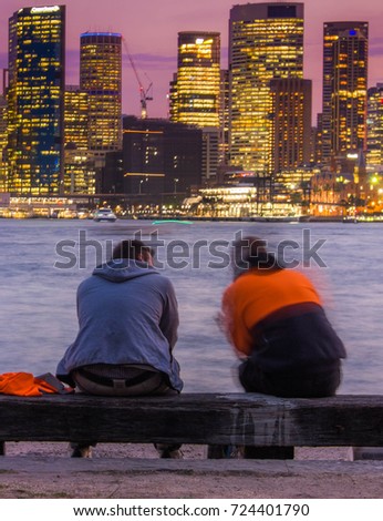 men are sharing idea in front of city view (without focusing on the people)