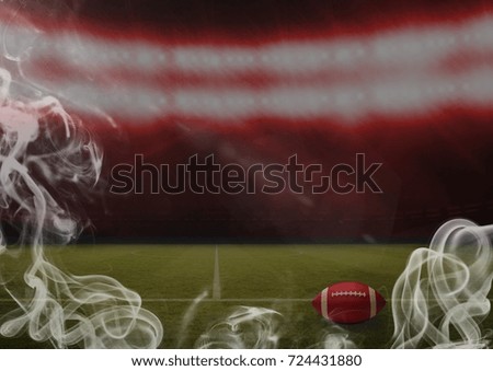 Digital composite of Red american football ball in stadium