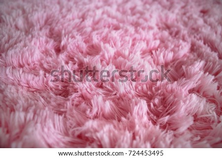 pink seamless wool texture close up as a background.Towel Texture.Blurred background of soft tissue. pink background of plush fabric