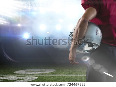 Digital composite of american football  player standing in stadium rear view