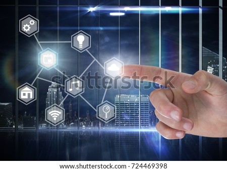 Digital composite of Hand touching icons interface of internet of things