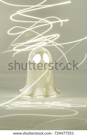 Halloween ghost isolated on white background with flash lights. 