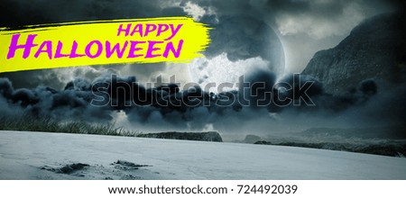 Digital image of happy Halloween text against view of landscape against cloudy sky