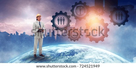 Architect taking notes against picture of the earth