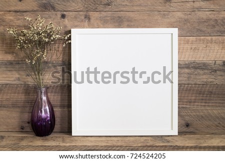 White square frame with dried flower in vase room.home decor retro style