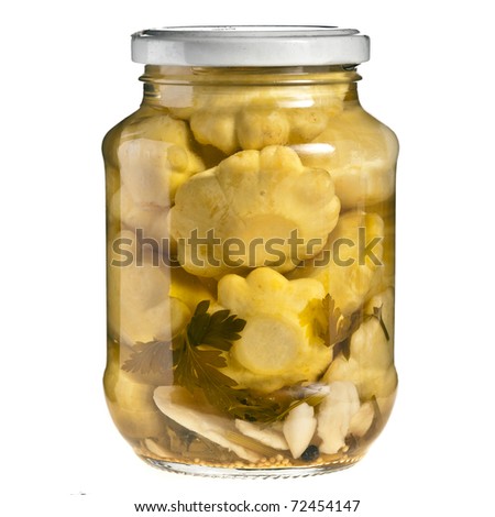 marinated scalloped squash in glass jar isolated on white