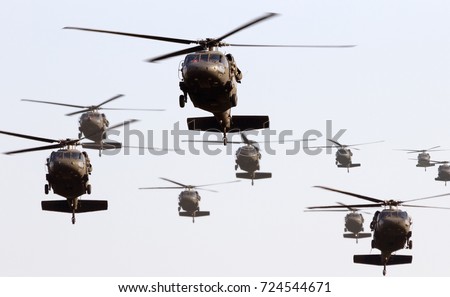 Military helicopter formation Royalty-Free Stock Photo #724544671
