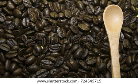 Spoon on top of coffee beans