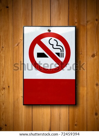 No smoking sign on Old wood wall background