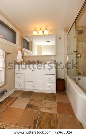 Luxury antique bathroom with white tub and tiles