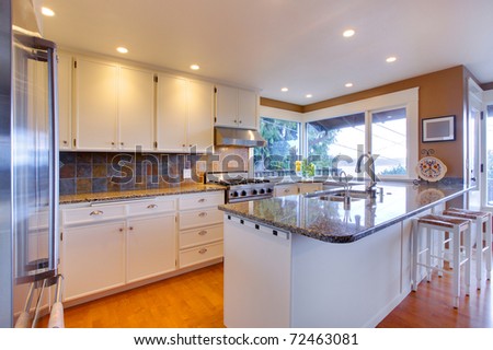 Luxury white kitchen, oak floors and beautiful granite