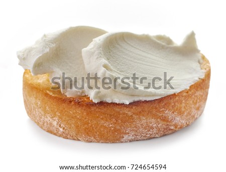 toasted bread with cream cheese isolated on white background, selective focus Royalty-Free Stock Photo #724654594