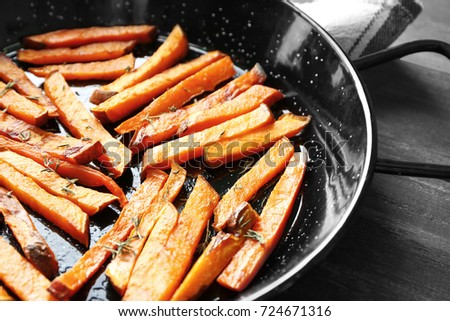 Frying pan with sweet potato fries, close up