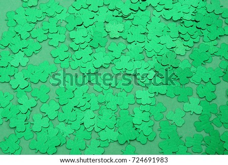 Saint Patrick's day seamless green background. Green background with three-leaved shamrocks. St. Patrick's day holiday symbol. holiday background