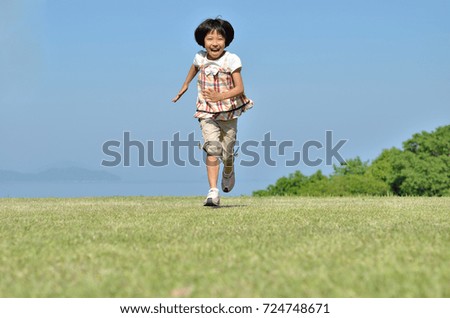 Girls running in the blue sky