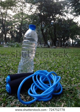 Mineral Water Bottle and Skipping Rope
