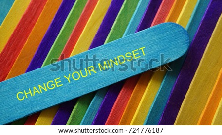 Concept colorful ice cream stick with word CHANGE YOUR MINDSET