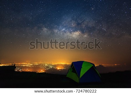 Milky way galaxy with dome tent at Phutabberk Phetchabun in Thailand.Long exposure photograph.With grain
