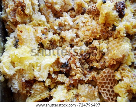 Background hexagon texture, wax honeycomb from a bee hive filled with golden honey. Honeycomb macro photography consisting of beeswax, yellow sweet honeys from beehive. Honey nectar of bees honeycombs