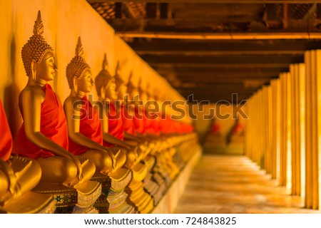 Golden Buddha is lined up at Wat Phutthaisawan, Phra Nakhon Si Ayutthaya, the worship of Buddhism in Thailand, the great archaeological site of Thailand, Is a Buddhist mind sticker. Royalty-Free Stock Photo #724843825