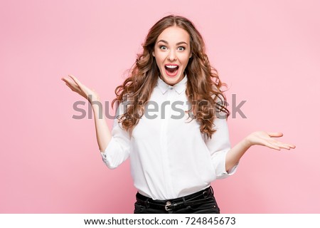 Surprised happy beautiful woman looking in excitement.