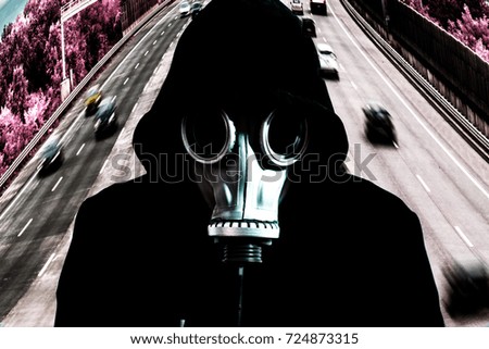 man in gas mask and highway in background