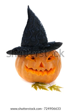 Halloween pumpkin in black hat on white background