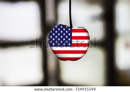 flag of USA painted on cherry or apple fruit