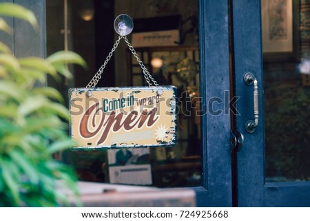Open signboard on shop door
