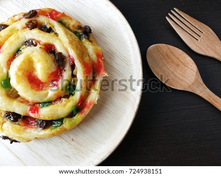 Danish pastry on top view and dark wood background.