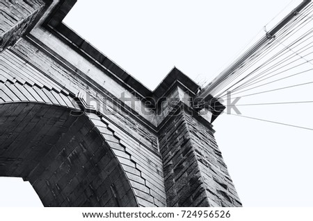 The Brooklyn bridge in New York city. In black and white, close up low angle view