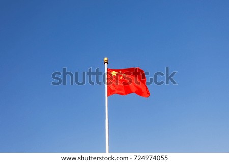 China's Five Starred Red Flag under the blue sky