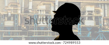 photo silhouette of Working Man in yellow Hard Hat, Man's Face in Safety Helmet on chemical factory with many pipes Background. male face of male engineer 
