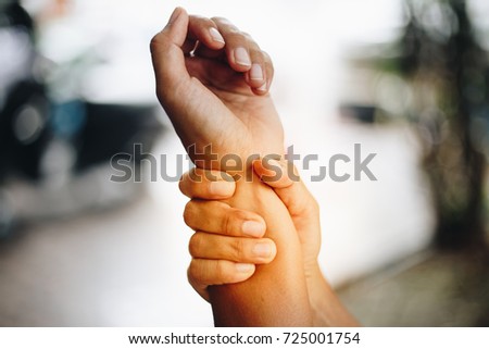woman pain at wrist, arm and hand
