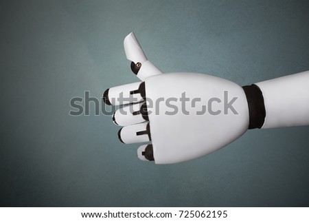Close-up Of Robot's Hand Showing Thumb Up Sign