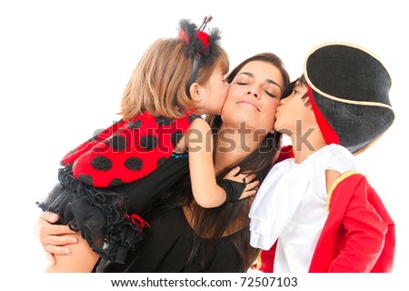 two beautiful children with costumes kissing a woman .