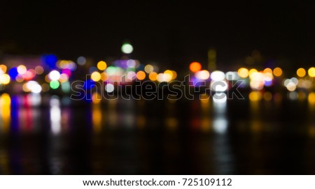 Blur black night background illustration with small colorful shining city lights like dots