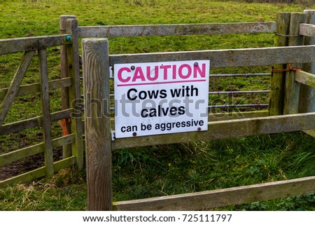 Sign on country gate Caution cows with calves can be aggressive.