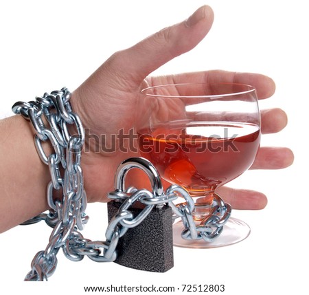 Color photo of wineglass of whiskey and metal chain Royalty-Free Stock Photo #72512803
