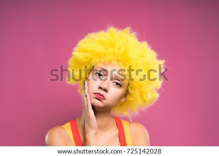 Sad girl in a yellow wig, the holiday was not a success