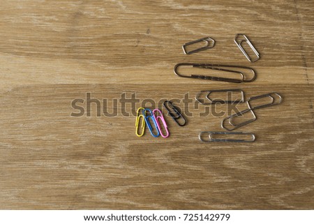 Paperclips on wooden table