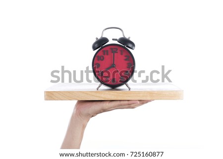 woman hand with a tray and clock alarm on white background, meal time and healthy concept