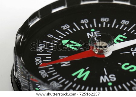 close up image of compass direction. Selective focus to North
