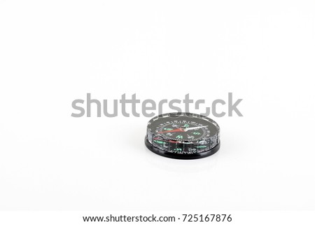 Compass over white background on the bottom right with a copy space