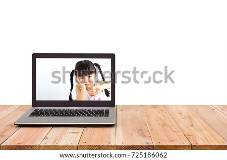 Computer on the table,The girl show unhappy symptoms on screen.