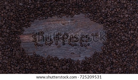 Coffee cup and beans on old kitchen table. Top view with copy-space for your text