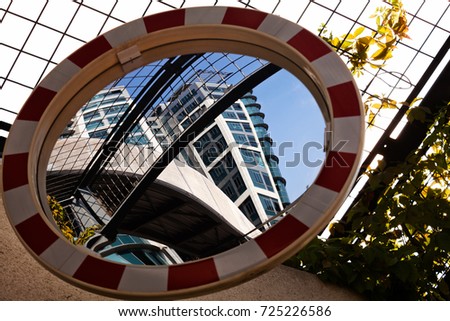 Traffic convex mirror reflecting the building